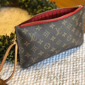 Great used condition Louis Vuitton wristlet in classic monogram w/ red interior